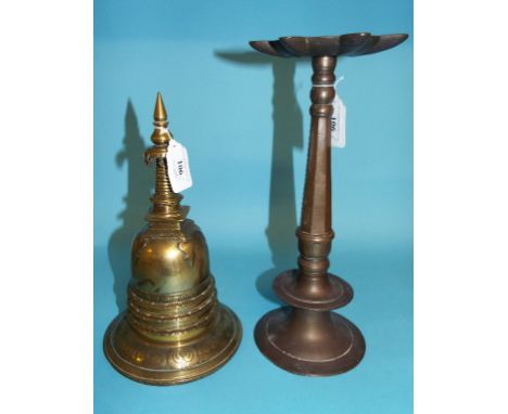 An Eastern brass stupa, 25.5 cm high, and an Islamic lamp, signed, 31 cm high (2)