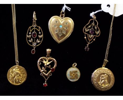 An Art Nouveau 9ct gold pendant, two others similar, a heart shaped locket and other jewellery