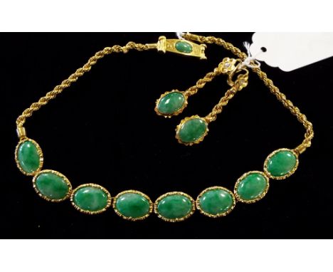 A 22ct gold and jade necklace, set oval panels, and a pair of similar drop earrings (2)