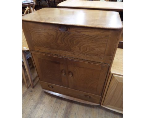 An Ercol elm cocktail cabinet, 82 cm wide