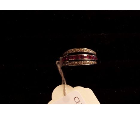 A sapphire, ruby and diamond flip over ring, in a white coloured metal mount