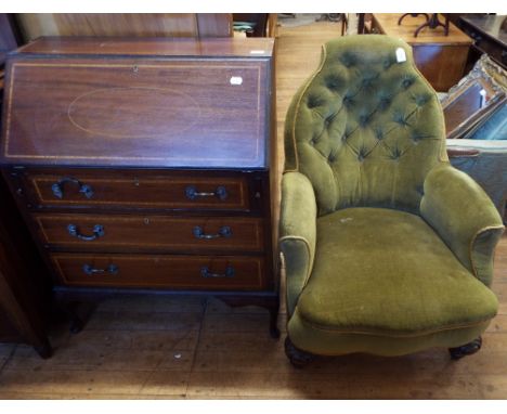 A Victorian button back upholstered armchair, on turned and carved front legs, and an inlaid mahogany bureau (2)