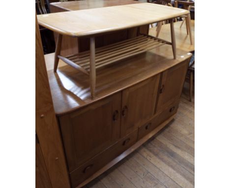 An Ercol elm sideboard, 128 cm wide, and an Ercol elm coffee table (2) Condition report Report by GH

The coffee table is gen