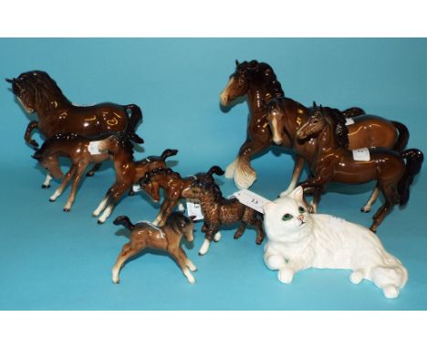 A Beswick Persian Cat, lying, white, 1876, four Beswick horses, and five Beswick foals (a.f.) (10) Condition report Report by