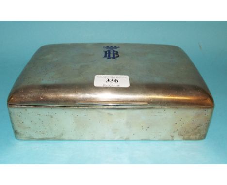 A Continental silver coloured metal tabletop cigar box, with enamel initials and coronet (chipped), 22.5 cm wide