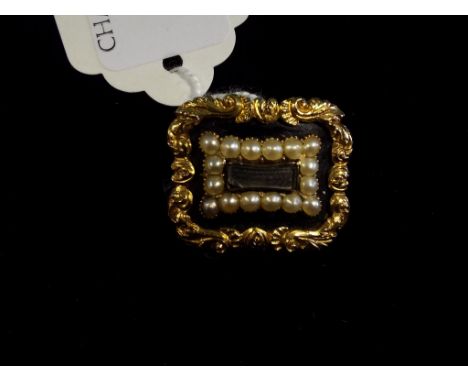 A 19th century yellow metal, seed pearl and enamel memoriam brooch