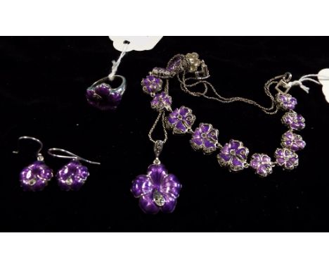 A silver, enamel and marcasite suite, comprising a necklace, a ring, a bracelet, and a pair of earrings (4)