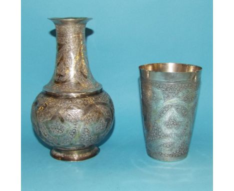 A Persian silver coloured metal decanter and cup/cover, with engraved foliate decoration, 19 cm high