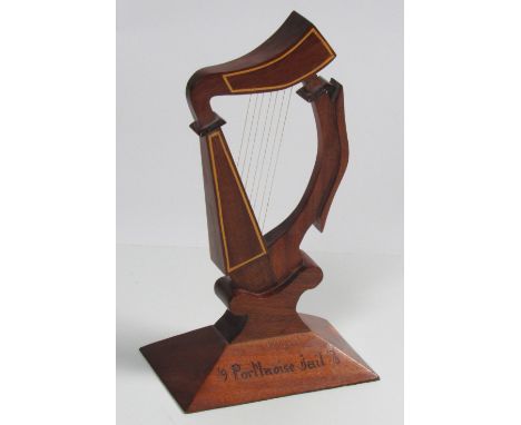 Prison Craft: A large hand carved and inlaid mahogany Harp, approx. 16" high, inscribed 'Michael, Theresa,'9 Portlaoise Jail 