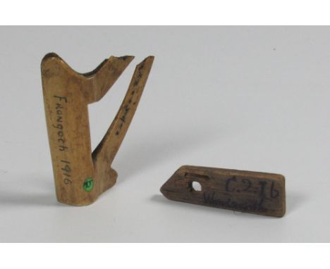 Republican Prison Craft: A carved animal bone in the shape of an Irish Harp, inscribed 'Frongoch 1916'; and a handmade wooden