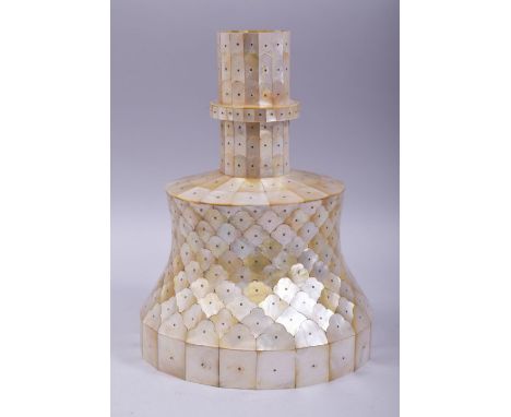 AN IMPRESSIVE INDIAN GOA MOTHER OF PEARL SCALE CANDLESTICK, onlaid all over with cut mother of pearl pieces including the int