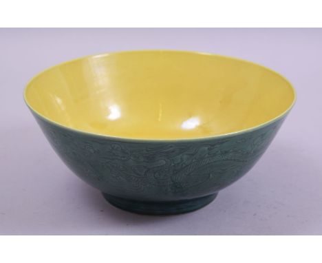 A CHINESE GREEN AND YELLOW GLAZE PORCELAIN BOWL, the exterior with incised decoration of dragons with the flaming pearl of wi