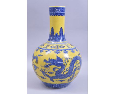 A CHINESE QING STYLE YELLOW GROUND PORCELAIN DRAGON VASE, the body decorated with blue dragons and the flaming pearl of wisdo