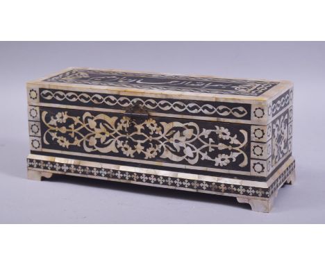 A TURKISH OTTOMAN MOTHER OF PEARL INLAID BOX with hinged lid, the mother of pearl inlay in the form of calligraphy to the lid