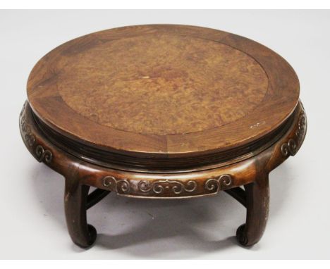 A GOOD CHINESE CIRCULAR LOW HARDWOOD AND BURR WOOD INLAID TABLE, with a carved frieze on five curving legs with scroll feet, 