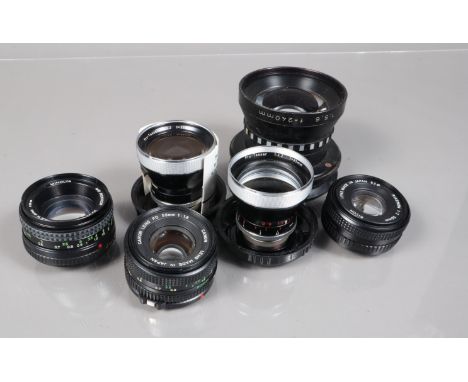 a Group of Prime Lenses, including a Canon FD 50mm f/1.8, a Minolta MD Rokkor 50mm f/1.7, a Carl Zeiss Pro Tessar 85mm f/3.2 