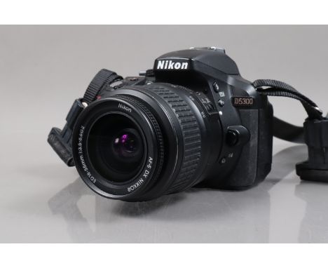 A Nikon D5300 DSLR Camera, serial no 2105080, body G, powers up, takes a picture, a Nikon DX VR AF-S Nikkor 18-55mm f/3.5-5.6