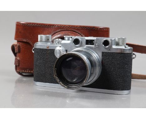 A Leitz Wetzlar Leica IIIc Rangefinder Camera, serial no 465491, 1949, body F, moderate scuffing, signs of corrosion, shutter