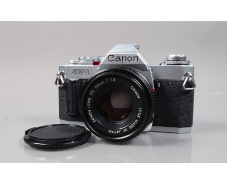 A Canon AV-1 SLR Camera, shutter working, meter responsive, functions in auto, self timer working, body G, light marks to bas