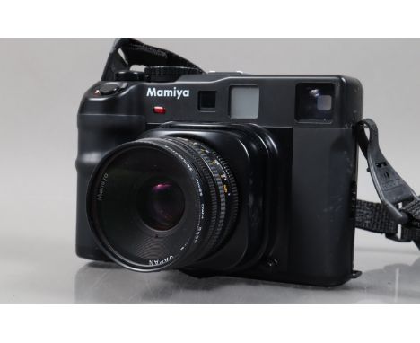 A Mamiya 6MF Rangefinder Camera, serial no 316318, body G-VG, some corrosion to battery compartment, shutter working, meter r