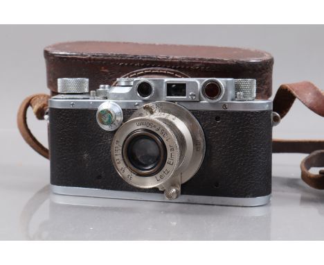 A Leitz Wetzlar Leica IIIb Rangefinder Camera, serial no 280645, 1938, body F, spots of corrosion, orange glass on rangefinde