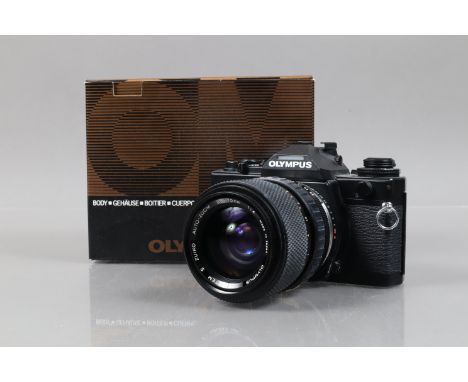 An Olympus OM-4 SLR Camera, serial no 1059864, body G-VG, shutter working, meter reacts to light, an S Zuiko Auto-Zoom 35-70m