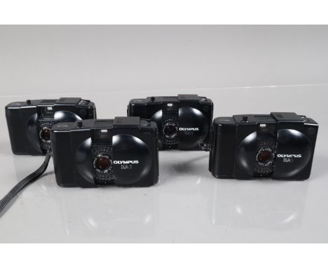 Four Olympus XA 1 Compact Cameras, shutters working, light cells responsive, bodies G, some wear, elements G 