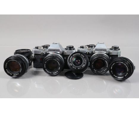 Two Olympus OM-10 Cameras, one shutter working, meter responsive, self timer working, with Zuiko 50mm f/1.8 lens, barrel G, e