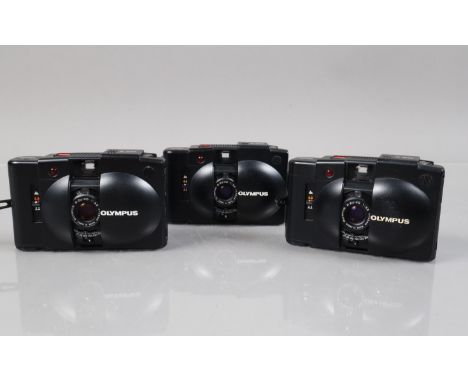 Three Olympus XA 2 Compact Cameras, shutters working, self timers working, bodies G, elements G, two with wrist straps 