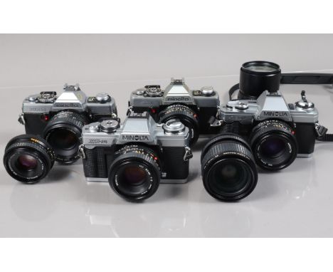 A Group of Minolta SLR Cameras, a Minolta XG-1, with MD 50mm f/1.7 lens, a XG-2, with MC Rokkor 50mm f/1.7 lens, a XG-M (issu