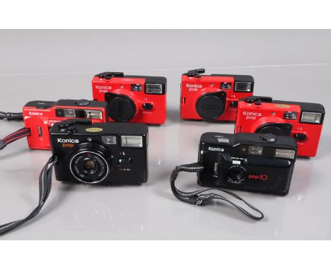 Six Konica Compact Cameras, three red Konica POP, one with ding to filter ring, shutters working, flash working, all with len