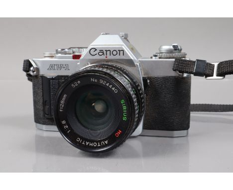 A Canon AV-1 SLR Camera, shutter working, meter responsive, self timer working, body G, with Sirius 28mm f/2.8 lens, G 