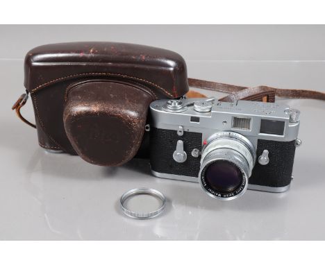 A Leitz Wetzlar Leica M2 Rangefinder Camera, serial no 1004083, 1960, body F-G, signs of use to top and bottom plates, shutte