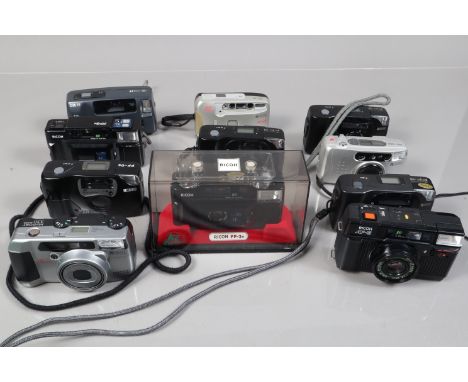 A Group of Ricoh Compact Cameras, including a Ricoh FF-3 AF, in shop display case, shutter working, flash working, VG, a AF-5
