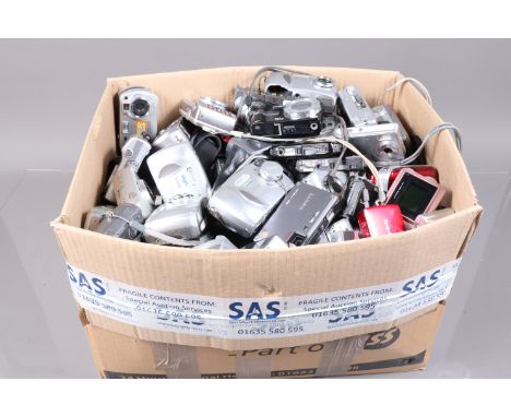 A Box of Compact Digital Cameras, manufacturers include Nikon, Minolta, Samsung, Kodak, Casio and other examples, untested, o