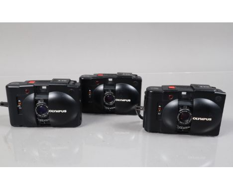 Three Olympus XA 2 Compact Cameras, shutters working, self timers working, bodies G, elements G, all with wrist straps 