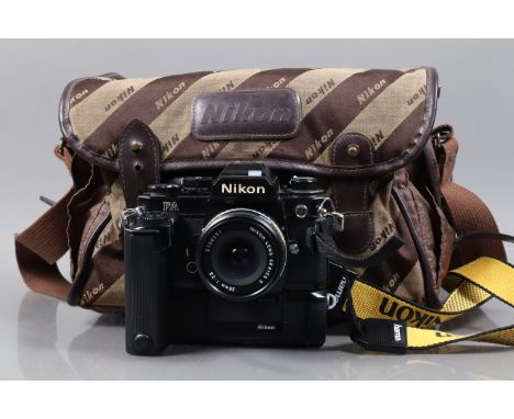 A Black Nikon FA SLR Camera, serial no 5146349, body F-G, brassing around film door and top plate, former owner's postcode on