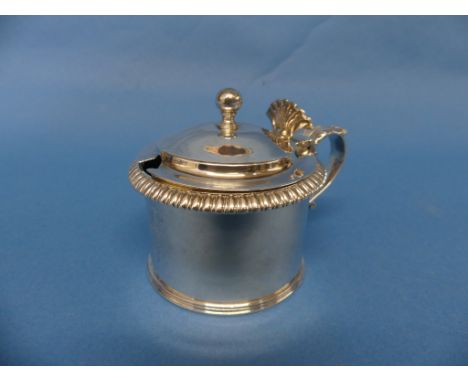 A George IV silver Mustard Pot, by Philip Rundell, hallmarked London, 1822, of circular form,the hinged lid with ball finial 