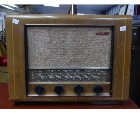 A retro Pye Model P76F Radio, the 1950s radio in walnut casing, with original Instruction Manual and Guarantee, together with