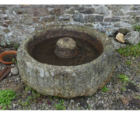 An antique granite circular Grinding Trough, 40in diameter x 15½in high (102cm x 39cm). Note; This lot can be Viewed at and m