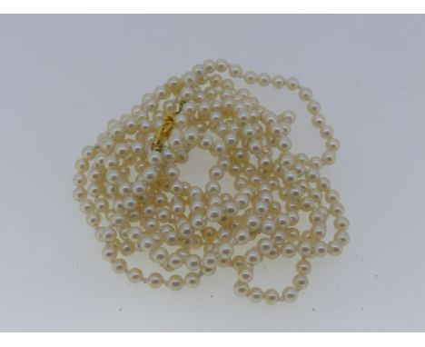 A cultured pearl Pendant, on a fine 18ct yellow gold trace chain, the chain 2.8g, together with two cultured pearl necklaces 