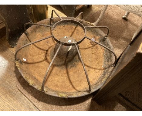 A vintage cast iron circular Pig Trough, of 'Mexican Hat' form with eight dividers, 30in (76cm) diameter.