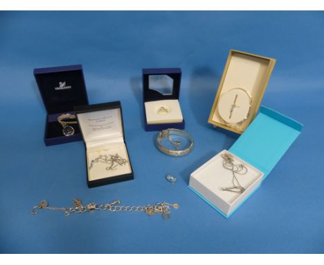 A collection of Silver Jewellery, including a Swarovski necklace, a Swarovski dress ring, a silver charm bracelet, a suite of