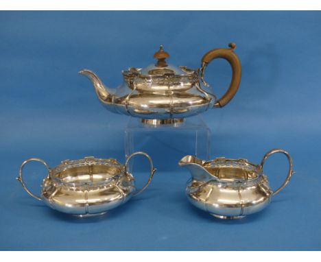 A George V silver three piece Tea Set, by Walker &amp; Hall, hallmarked Birmingham, 1918 (the cream jug 1921), of lobed squat
