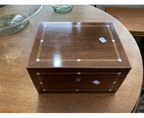 A late Victorian mahogany fitted Jewellery Box, with boxwood stringing and mother of pearl inlay, the interior with mirrored 