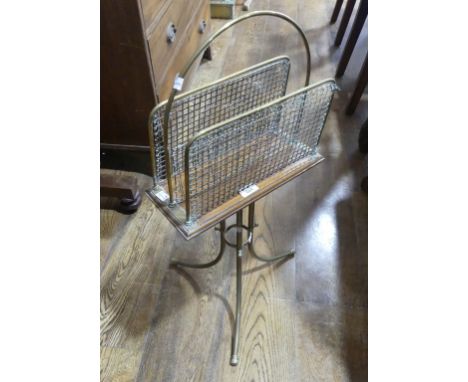 An antique brass and mahogany Magazine Rack, the three brass and mesh dividers on mahogany board, raised on splayed tripod ba