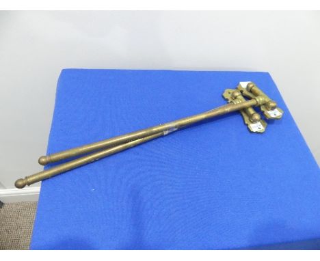 A pair of vintage brass hinged swing-arm Curtain Rods, 16in (40.5cm) long (2)