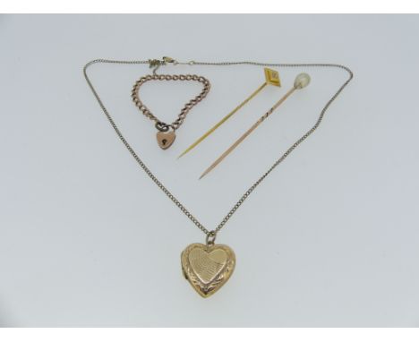 A yellow gold and diamond set Tie Pin, the diamond shaped finial set with a small diamond, unmarked but tested, together with