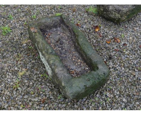 An antique granite rectangular Trough, 35in long x 16½in wide x 9in high (89cm x 42cm x 23cm). Note; This lot can be Viewed a