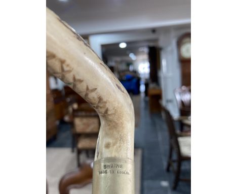 A vintage 'Swaine' leather Hunting Whip, with plaited leather shaft, 54in (1½yards) plaited thong, antler handle, the white m